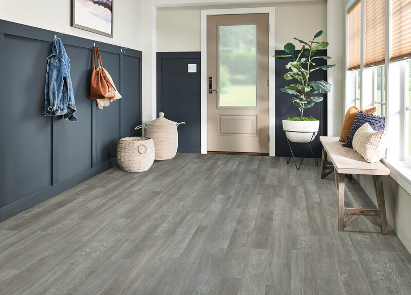 Entryway with a bench and gray LVT flooring