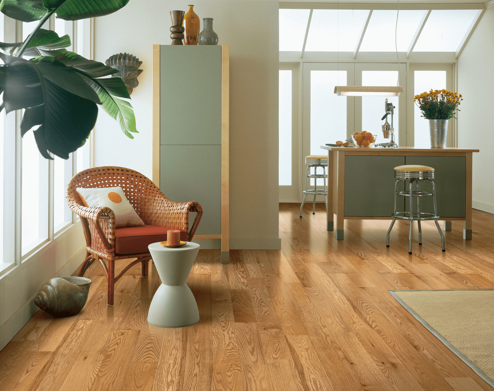 Dundee Red Oak Solid - Natural Seating area outside a free standing bar with red oak solid hardwood flooring from Bruce