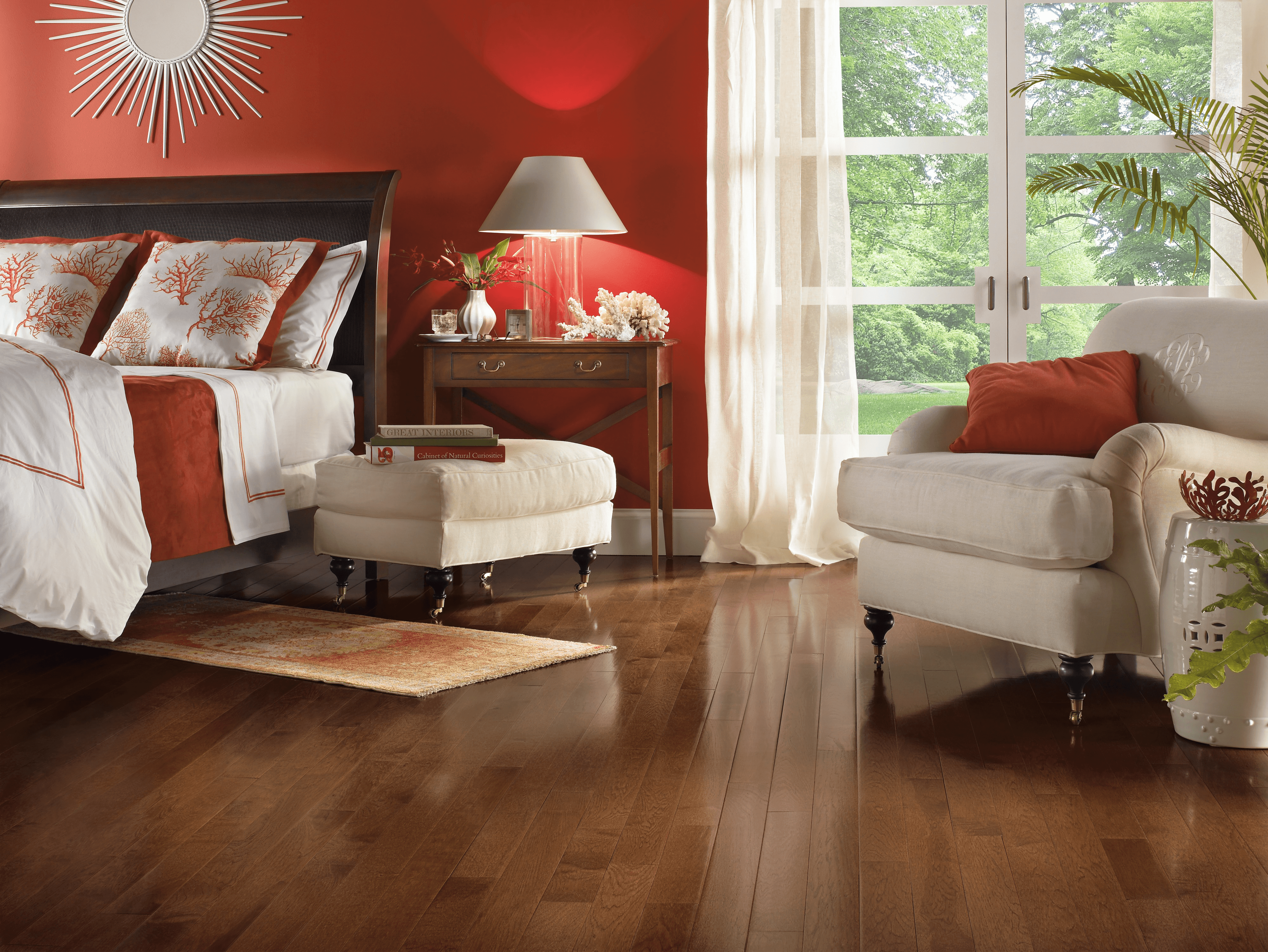 American Treasures Hickory Solid - Plymouth Brown Modern bedroom with a seating area and French doors featuring hickory hardwood floors from Bruce
